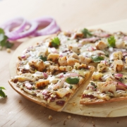 barbecue chicken pizza on table