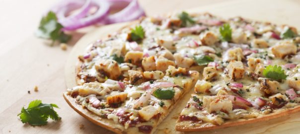 barbecue chicken pizza on table